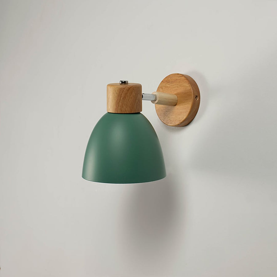 Green wall light with natural wood fixture turned off against white wall highlighting its clean and modern design.
