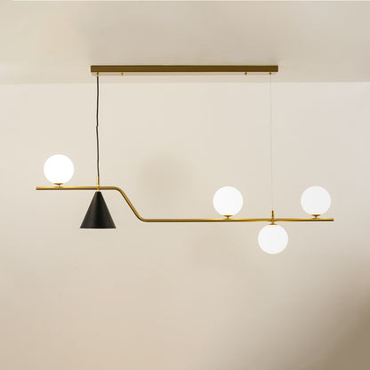Gold metal chandelier with frosted glass globe shades and cone accent creating elegant modern ceiling lighting indoors.