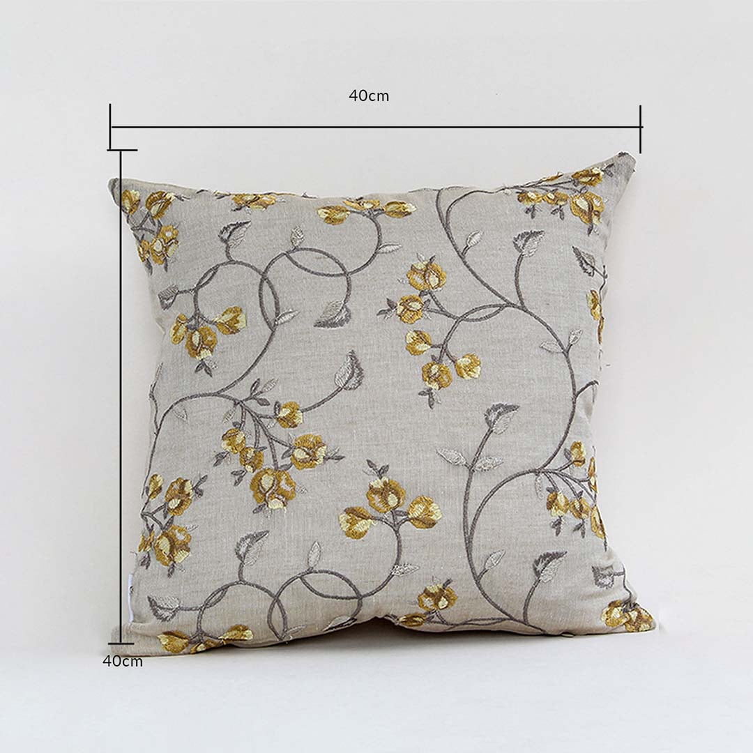Cushion cover with yellow floral design shown with height and width guides marking its exact 40 cm x 40 cm size helping users choose the right option for home décor.