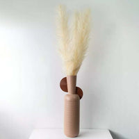 Large dried pampas grass arrangement in a rustic brown ceramic vase perfect for boho home décor and modern minimal interior styling.