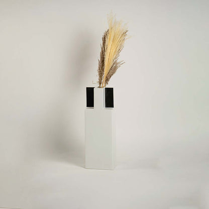 Contemporary ceramic vase with pampas grass decor placed in luxury living room interior modern table styling accent.