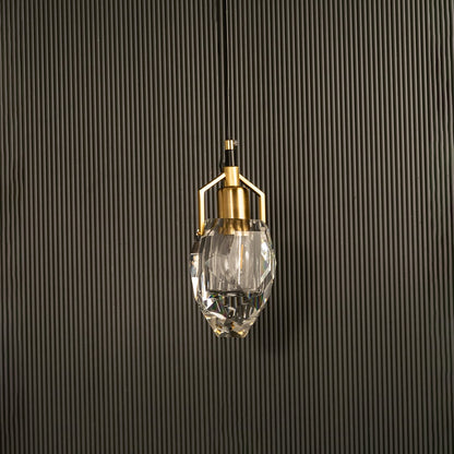 Crystal pendant light with metal accents shown switched off against a dark background presenting a refined luxurious silhouette for contemporary interior decor.