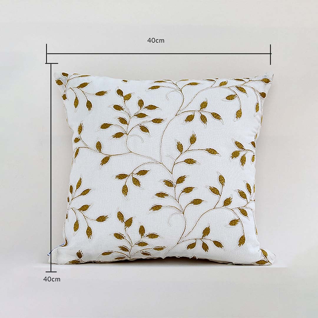 White cushion cover with golden leaf design displayed with guides showing its exact 40 cm x 40 cm size perfect for elegant home décor styling and modern interior accents.