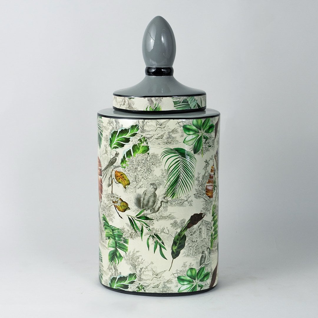 Tropical leaf jar with elegant botanical design shown clearly on a plain white background.