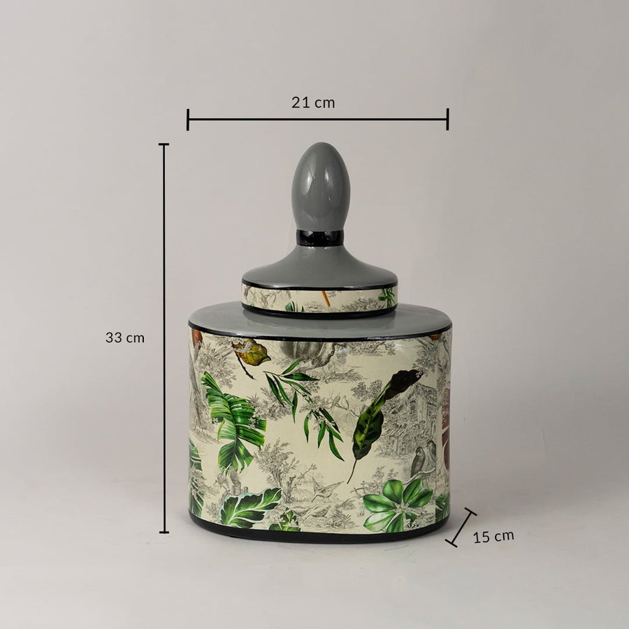 Tropical leaf jar measuring 33 cm tall and 21 cm wide with botanical detailing and grey lid design.