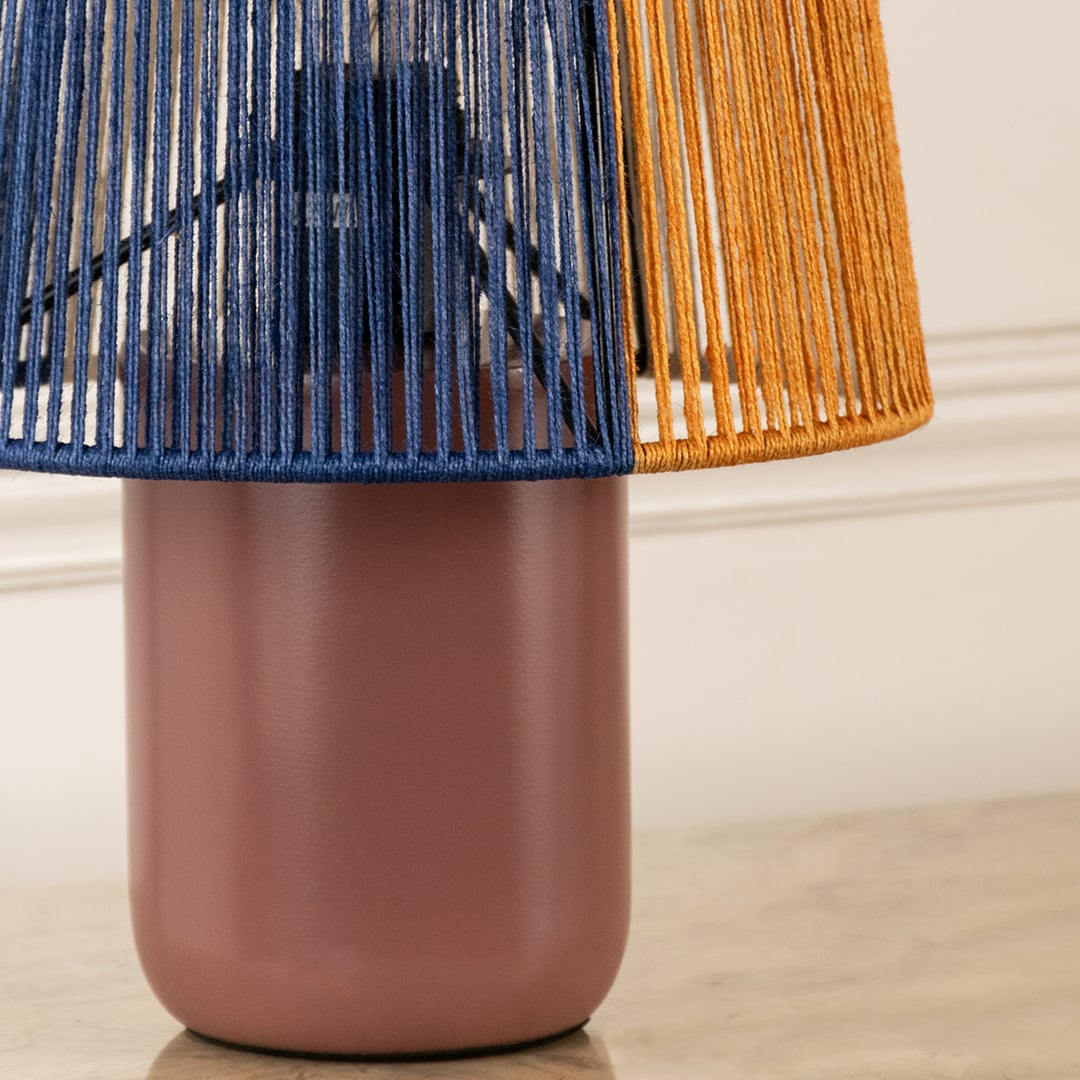 Closeup view of table lamp showing detailed woven blue and orange shade with smooth matte base highlighting modern table lamping perfect for interior home decor.