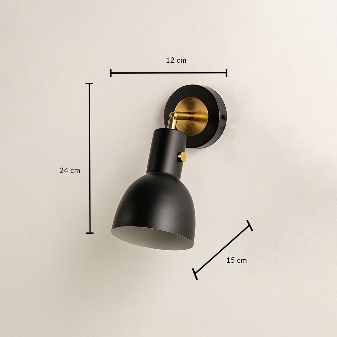 A black metal wall light measuring 24 cm height 15 cm depth and 12 cm width displayed against a beige wall highlighting its compact geometric form for refined contemporary décor.