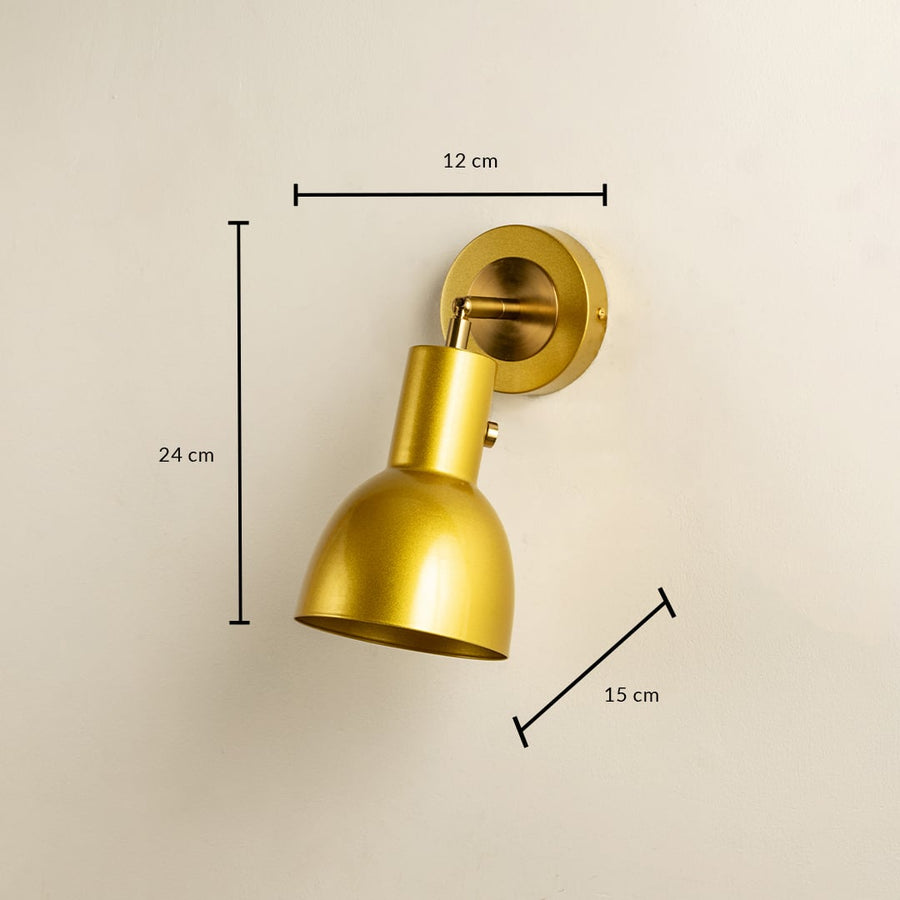 A gold metal wall light measuring 24 cm height 15 cm depth and 12 cm width presented on a neutral beige wall showcasing its brushed finish and adding luxurious modern décor.