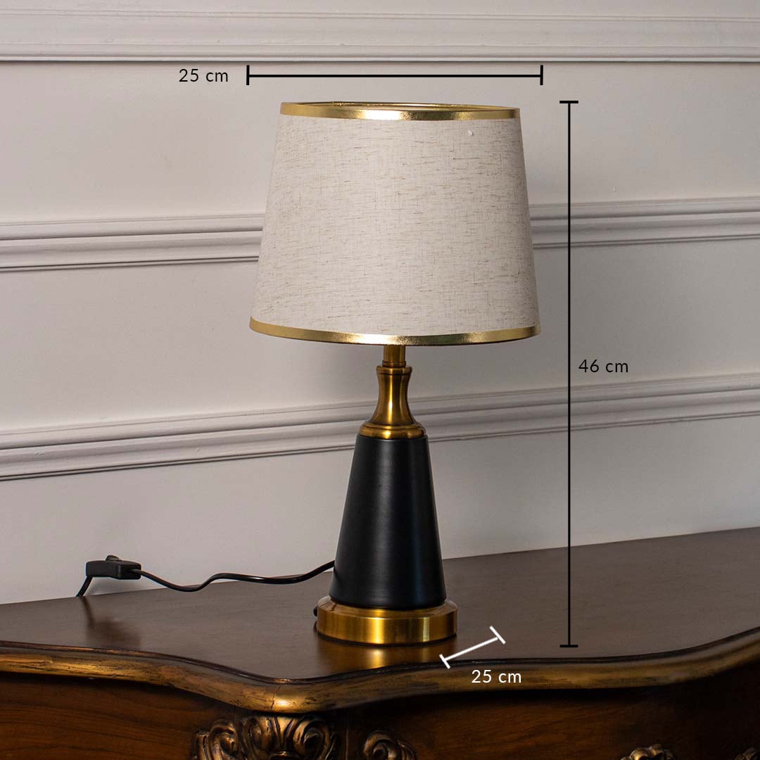 Modern table lamp showing 46 cm height and 25 cm width dimensions with gold and black base and fabric shade.