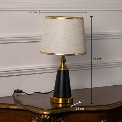 Modern table lamp showing 46 cm height and 25 cm width dimensions with gold and black base and fabric shade.