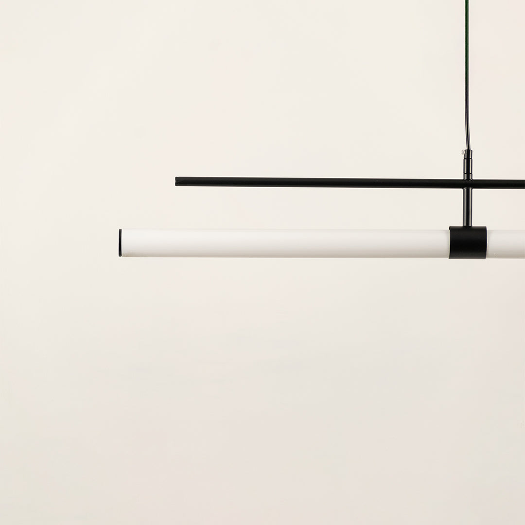 Black and white linear LED pendant light showcasing sleek metal craftsmanship and minimalist contemporary lighting design.
