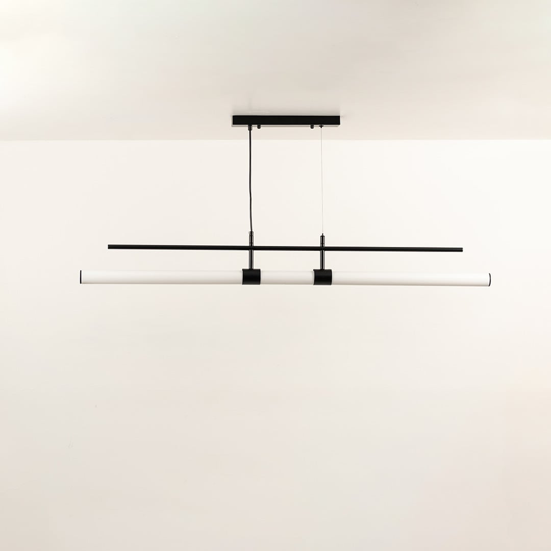 Sleek linear ceiling light with slim black and white intersecting bars creating a balanced warm illumination that enhances the room with a contemporary visual accent.