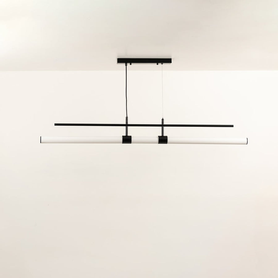 Sleek linear ceiling light with slim black and white intersecting bars creating a balanced warm illumination that enhances the room with a contemporary visual accent.