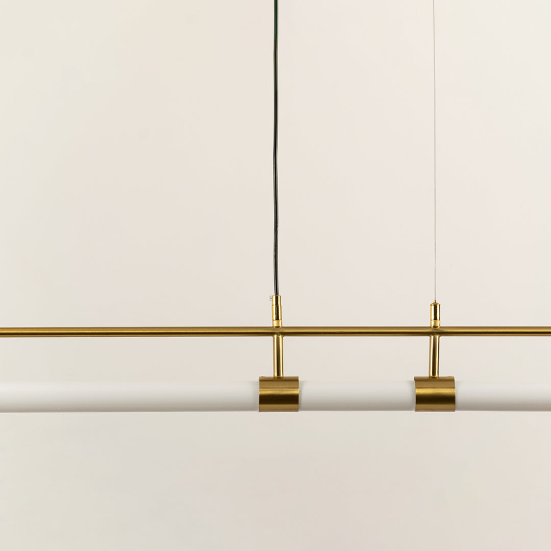 Gold metal linear LED pendant light showcasing sleek craftsmanship and minimalist modern ceiling lighting design.