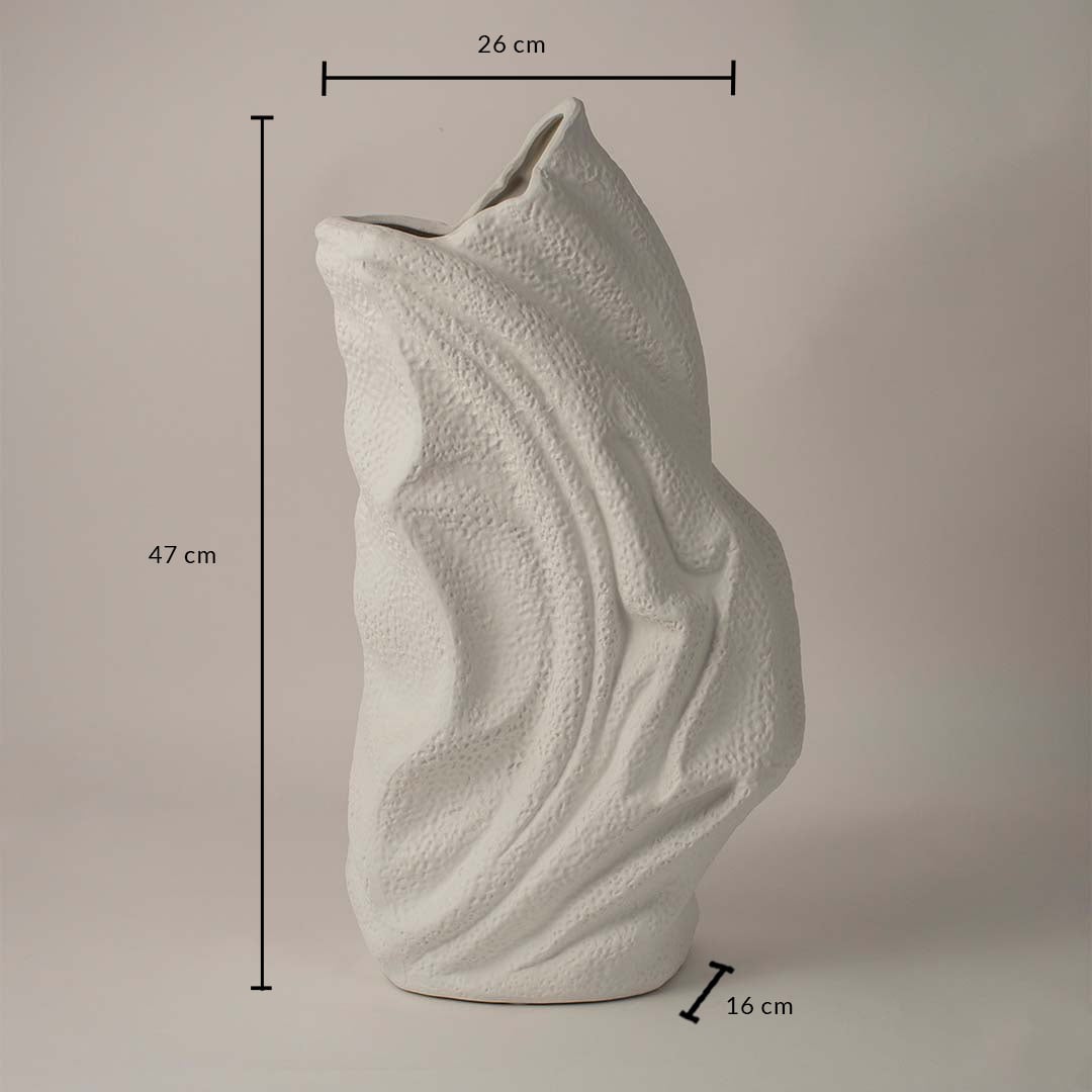 White ceramic decorative vase with wavy texture showing 47 cm height 26 cm width and 16 cm depth on white background.