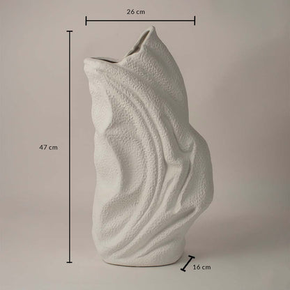 White ceramic decorative vase with wavy texture showing 47 cm height 26 cm width and 16 cm depth on white background.
