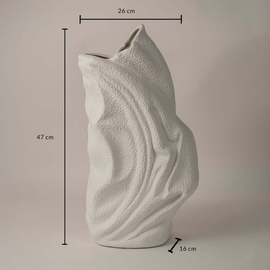 White ceramic decorative vase with wavy texture showing 47 cm height 26 cm width and 16 cm depth on white background.