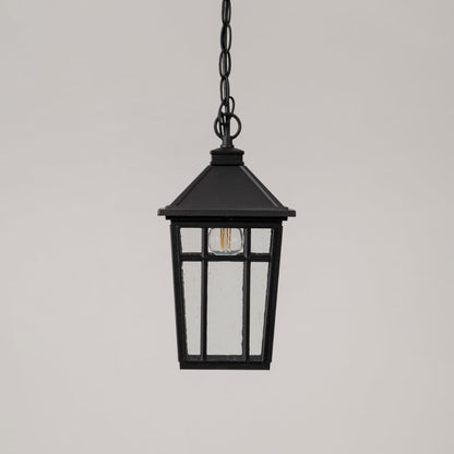 Traditional black hanging lantern with clear glass and chain suspension switched off displayed on minimal white backdrop.