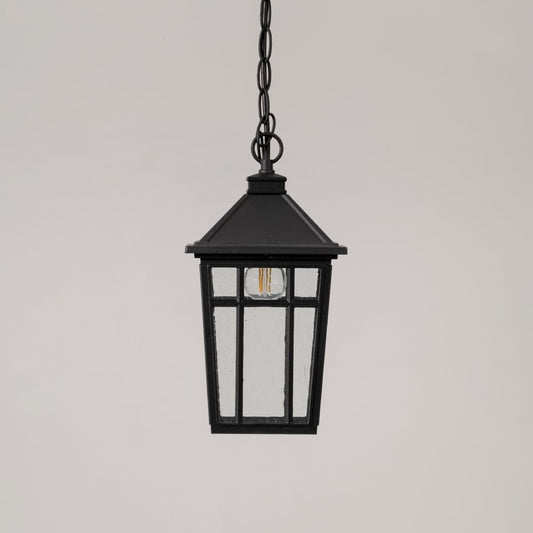Traditional black hanging lantern with clear glass and chain suspension switched off displayed on minimal white backdrop.