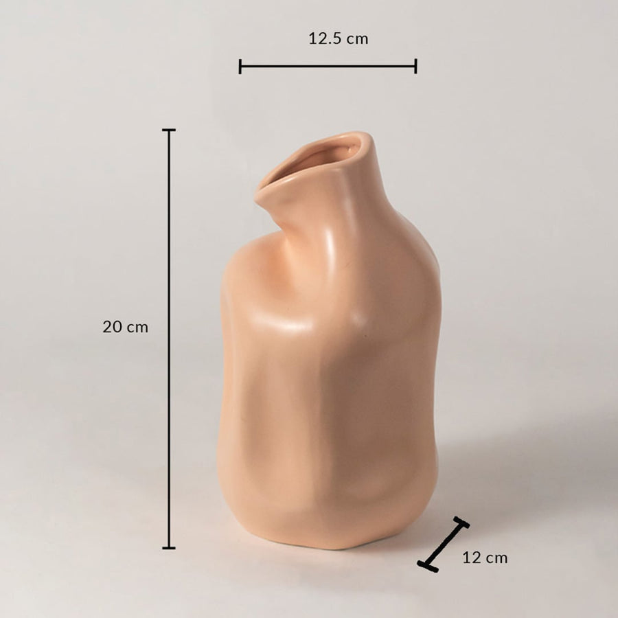Beige sculptural ceramic vase measuring 20 cm height 12.5 cm width and 12 cm depth shown on white background reference.