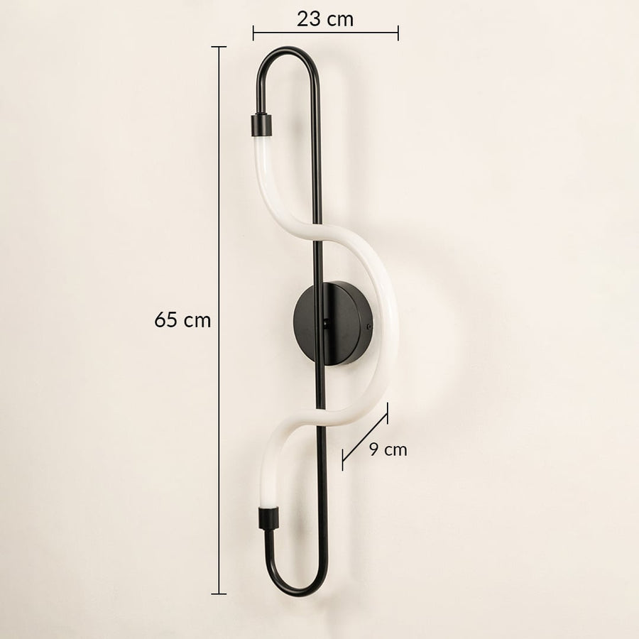 A black LED wall light shown on a white background with clear dimensions of 65 cm height 23 cm width and 9 cm depth for accurate fitting.