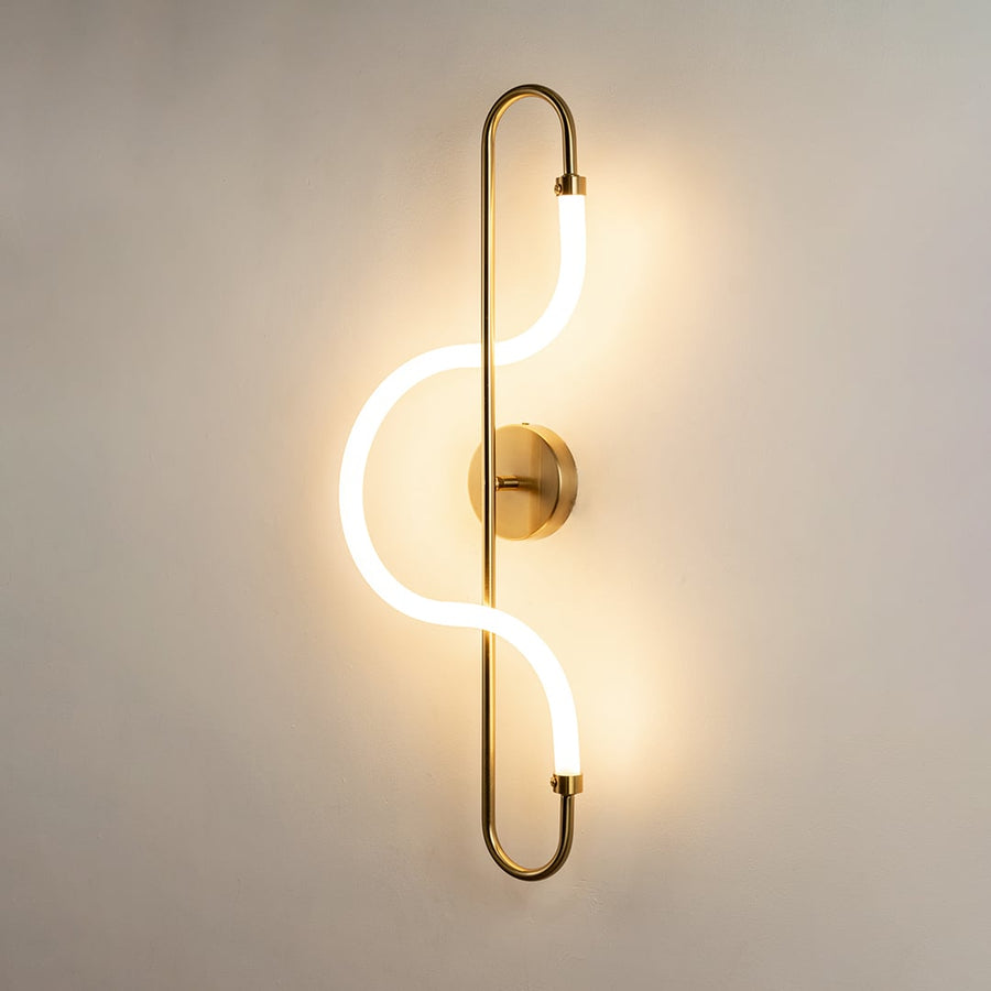 Modern gold LED wall light with artistic glow for elegant hallway and luxury decor styling spaces.
