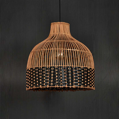 Two-tone rattan pendant light on black background highlighting intricate craftsmanship and balanced woven texture.