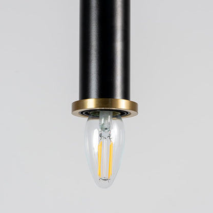 Closeup of black pendant ceiling lamp with golden rim featuring a cylindrical modern design lighting fixture.