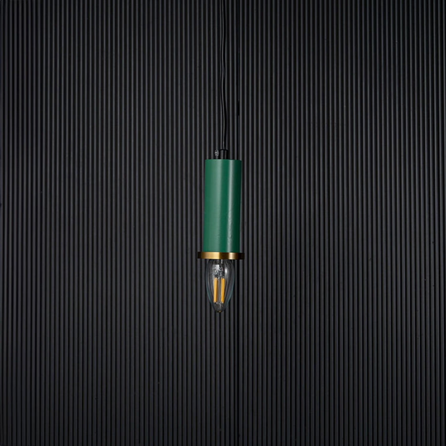 Green pendant light turned off with brass ring and clear bulb shown as elegant ceiling decor on black background.