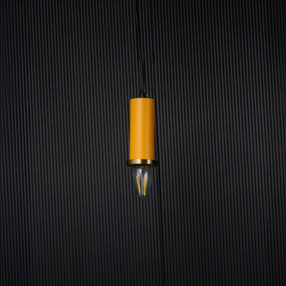 Yellow pendant light turned off with brass accent and bulb shown as modern hanging decor on black background.