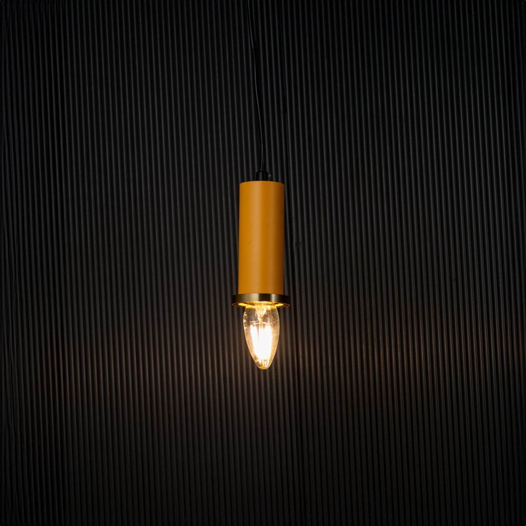 Elegant yellow pendant light turned on with warm glow creating ambient ceiling lighting on black background.