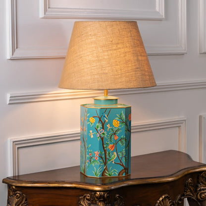 Lost Garden table lamp turned on against white background revealing organic pattern gentle glow and calming interior lighting style.