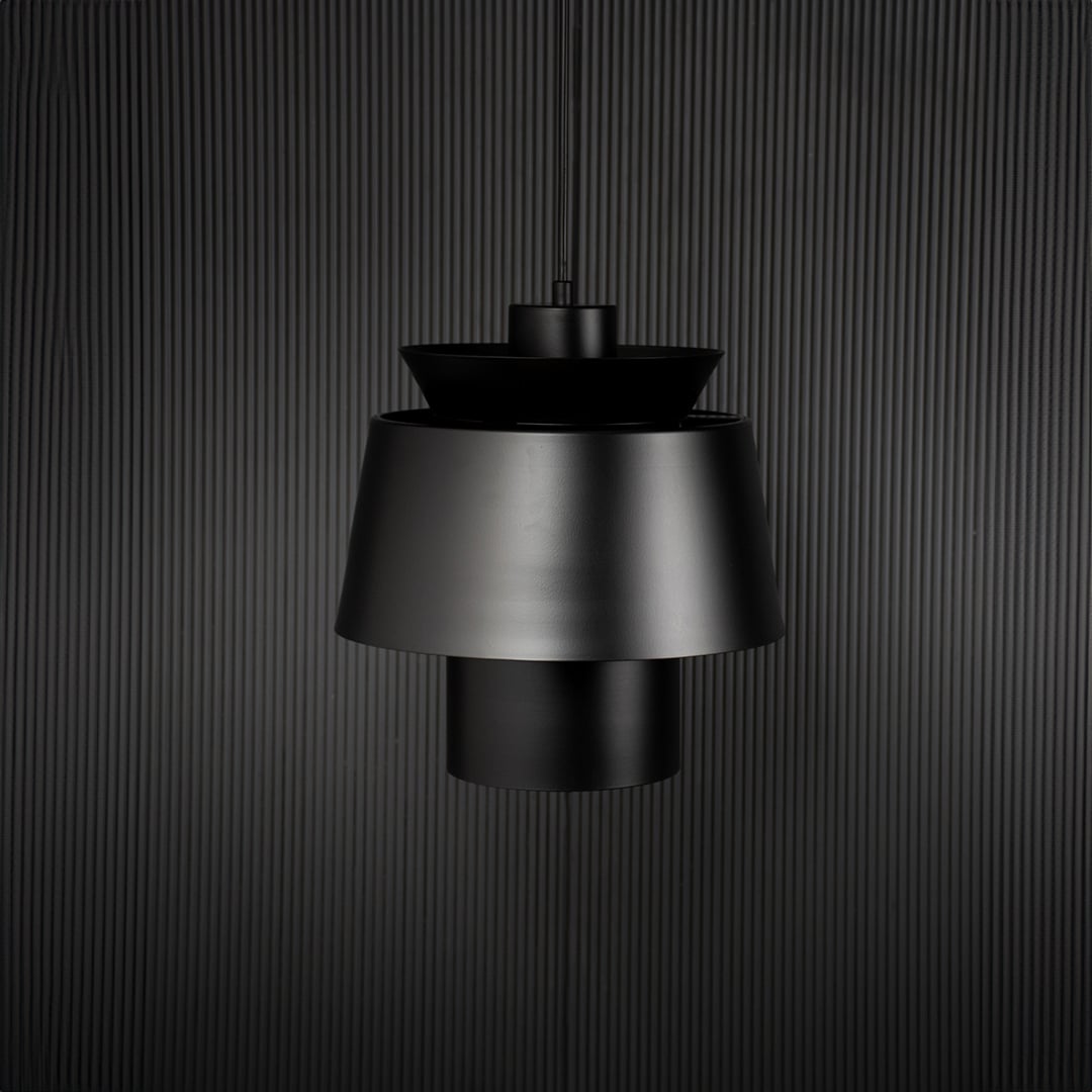 Black metal pendant light with layered shade bringing modern elegance to kitchen ceiling spaces.