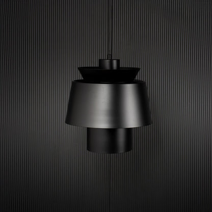 Black metal pendant light with layered shade bringing modern elegance to kitchen ceiling spaces.