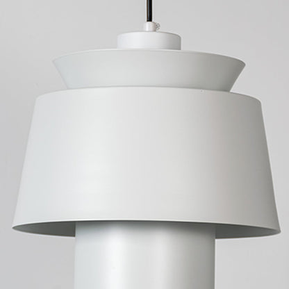 A closeup view of a modern pendant lamp focusing on its layered shade structure and refined detailing for a clear look at its craftsmanship.