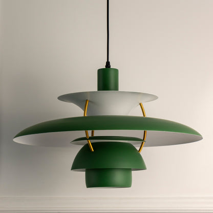 Green layered metal pendant light with brass accents designed for stylish modern interiors.