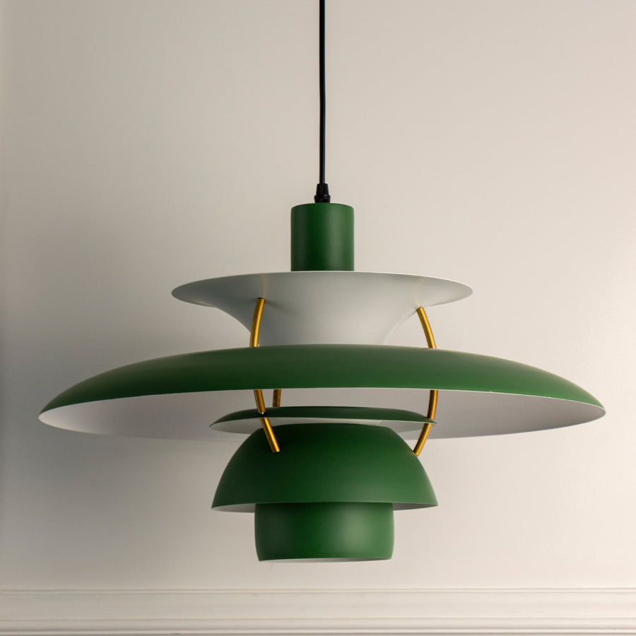 Green layered metal pendant light with brass accents designed for stylish modern interiors.