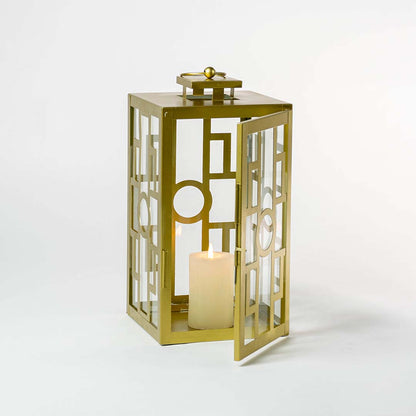 Decorative gold metal lantern with clear glass panels for luxury indoor tabletop decor styling.