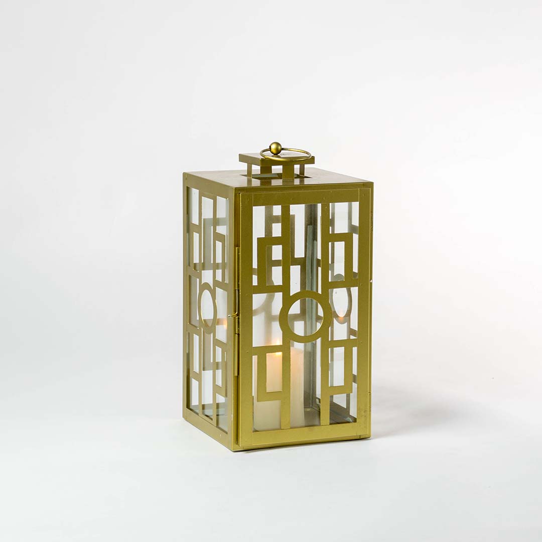 Stylish gold lantern glowing against a dark white background highlighting its elegant metallic finish and intricate geometric grid pattern.