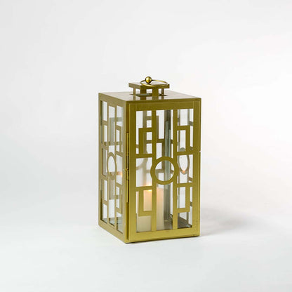 Stylish gold lantern glowing against a dark white background highlighting its elegant metallic finish and intricate geometric grid pattern.
