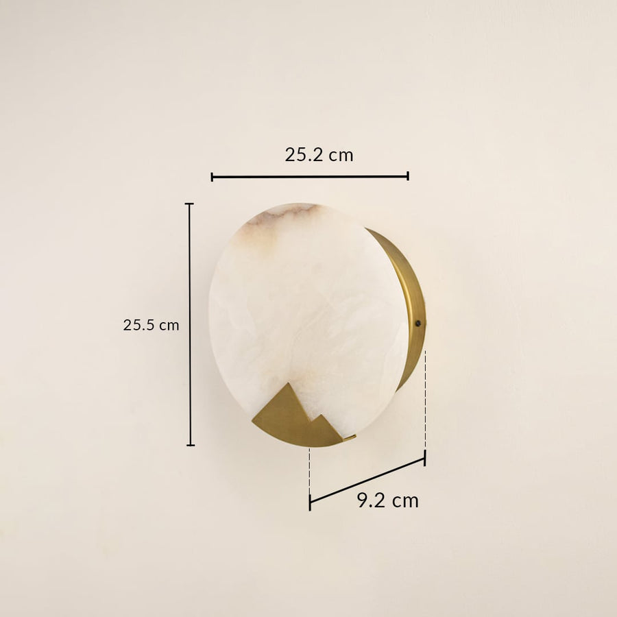 Designer marble wall light measuring 25 cm with brass detailing ideal for modern interiors needing warm ambient wall illumination.