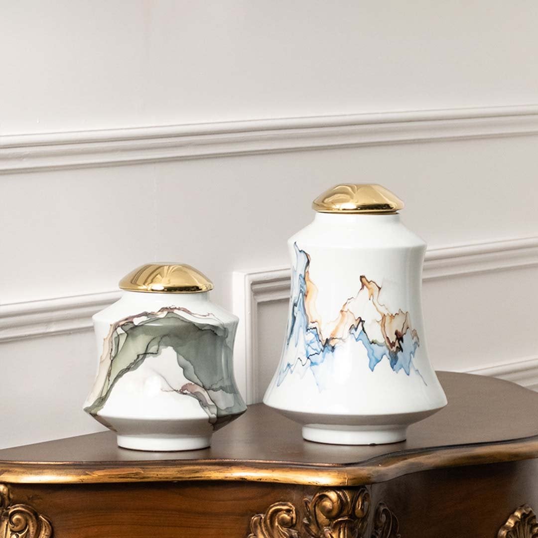 White ceramic jars with blue horse artwork ideal for classic console décor and elegant home styling.