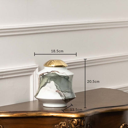 White ceramic jar with gray abstract swirl and gold lid shown with dimensions 20.5 cm height and 18.5 cm width.
