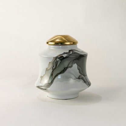 White ceramic jar with gray abstract swirl design shown on simple background for elegant contemporary décor.