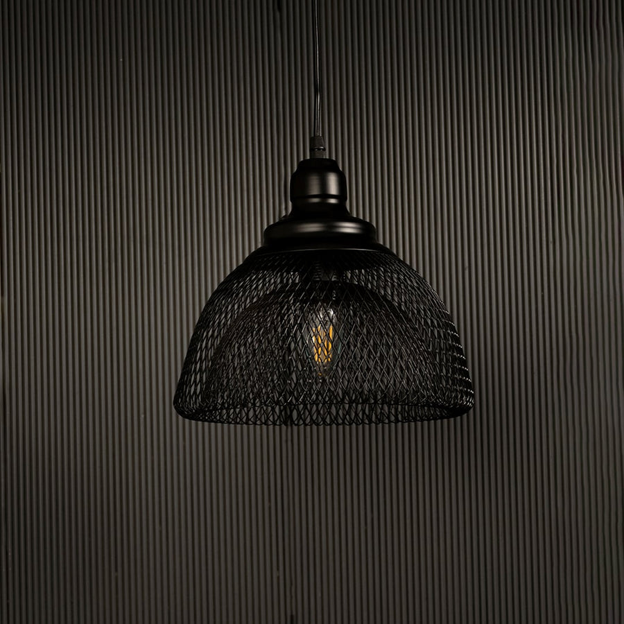 Modern industrial black mesh pendant light displayed on dark background with lights off showing contemporary artistic design.