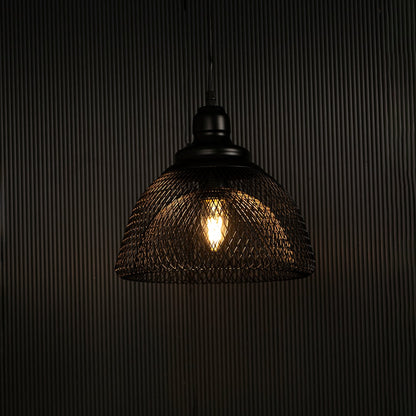 Elegant black mesh pendant light illuminated against dark background highlighting artistic industrial style and fine craftsmanship.