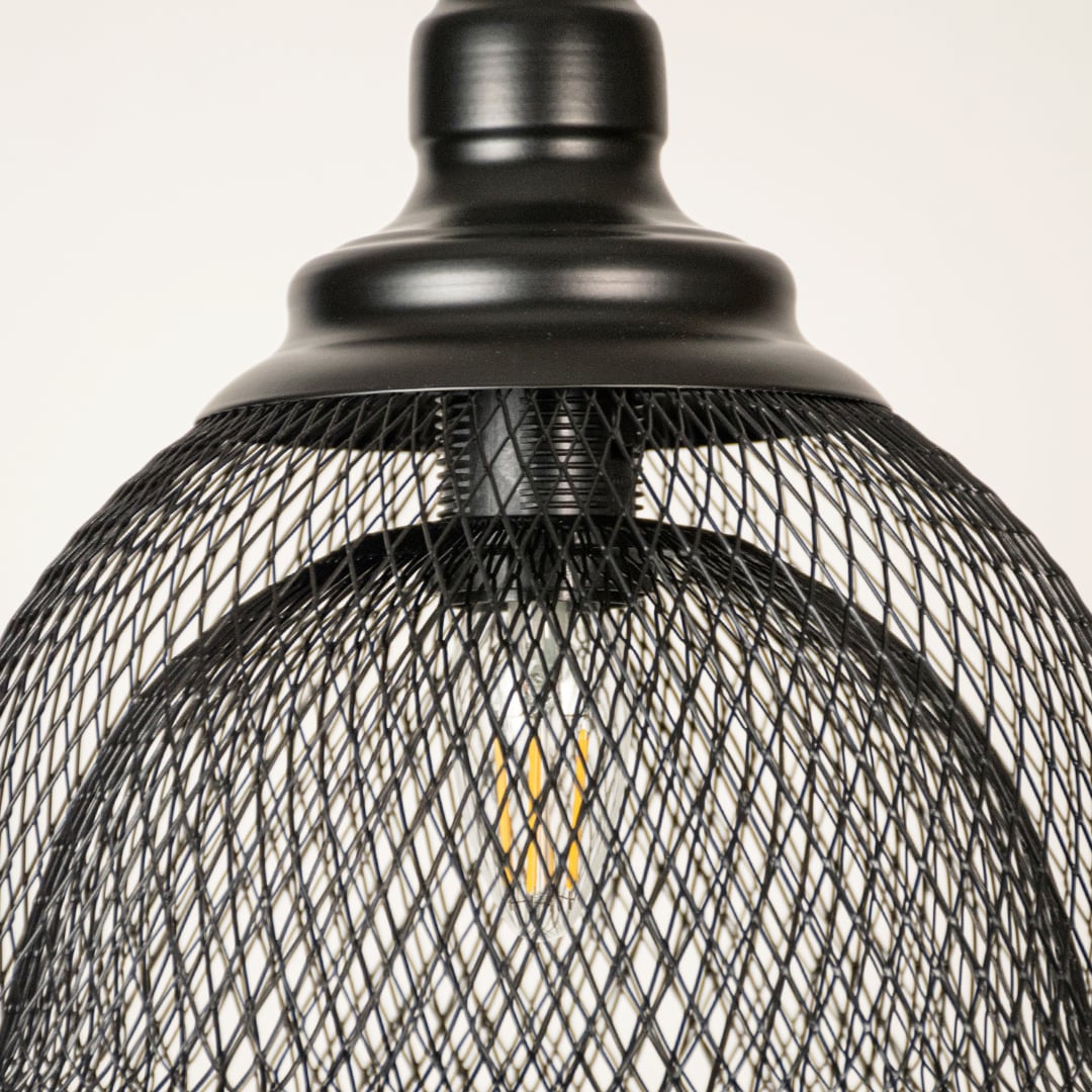 Black metal mesh pendant light closeup highlighting intricate wire detailing and premium industrial lighting craftsmanship.