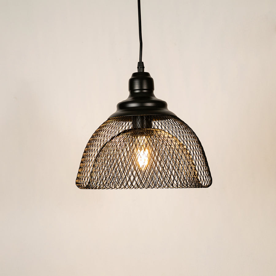 Black metal mesh pendant light illuminated to showcase industrial ceiling lighting with warm glow and modern appeal.