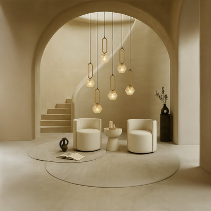 Gold crystal pendant lights illuminating arched living space with elegant warmth and modern charm.