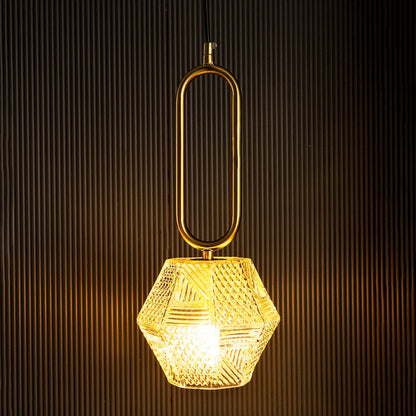 Hexa pendant light turned on glowing through textured glass shade with golden accent against dark background for luxury lighting style.